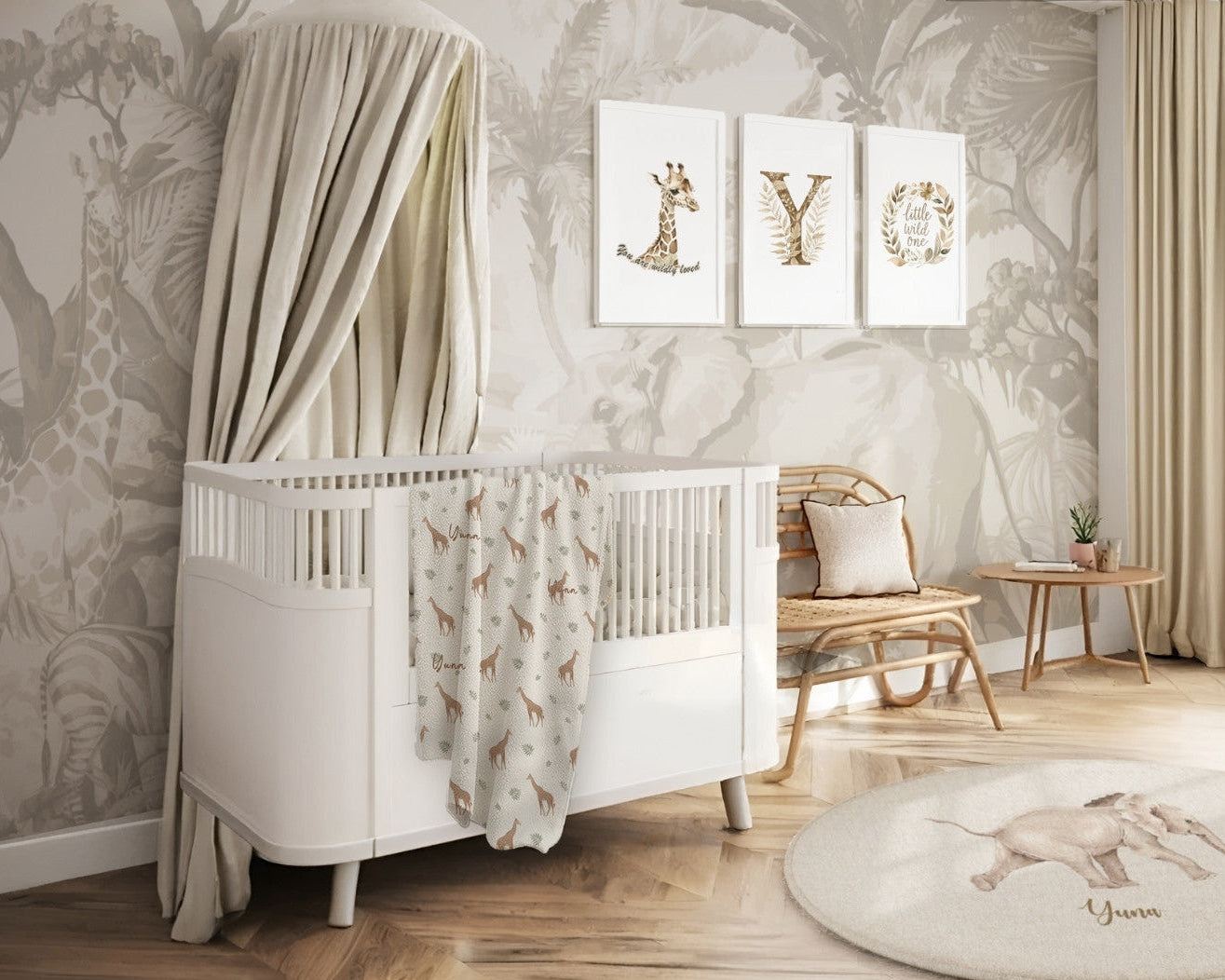 Nursery room with white crib, decorative wall art, and wooden floor.