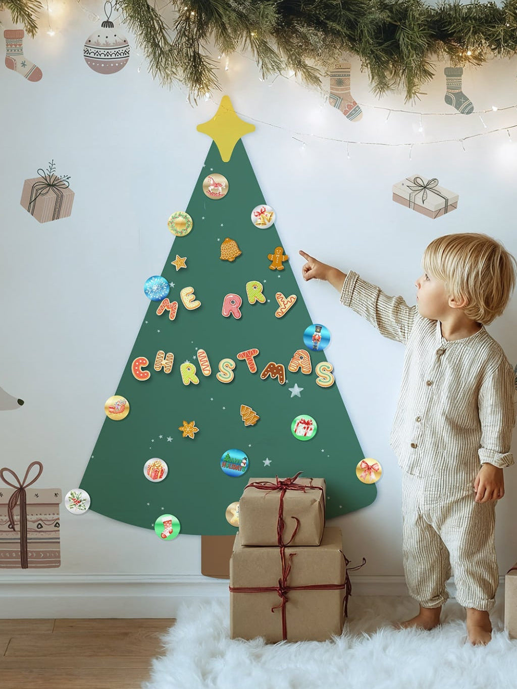 Child decorating a Christmas tree made of colorful letters on a wall with festive decorations.