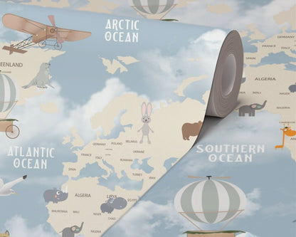 Children's world map with animals and vehicles on a blue background