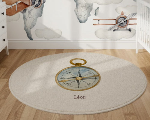 Round rug with a compass design in a nursery setting