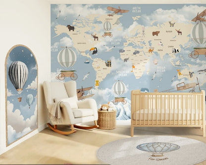 Nursery room with world map wall mural, crib, and rocking chair.