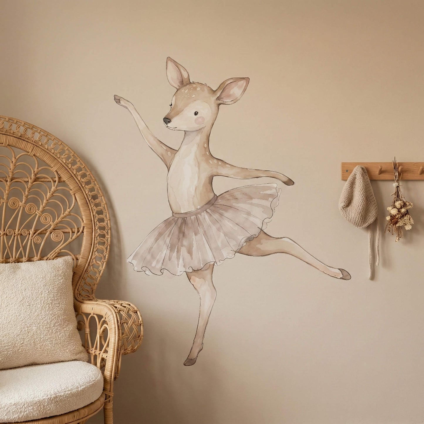 Ballerina deer wall sticker on a neutral nursery wall styled with boho decor, bringing a soft ballet theme into the room.