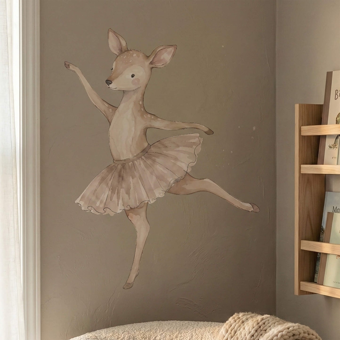 Watercolor ballerina deer wall sticker displayed on a textured wall in a cozy nursery corner, adding gentle movement and warmth to the space.