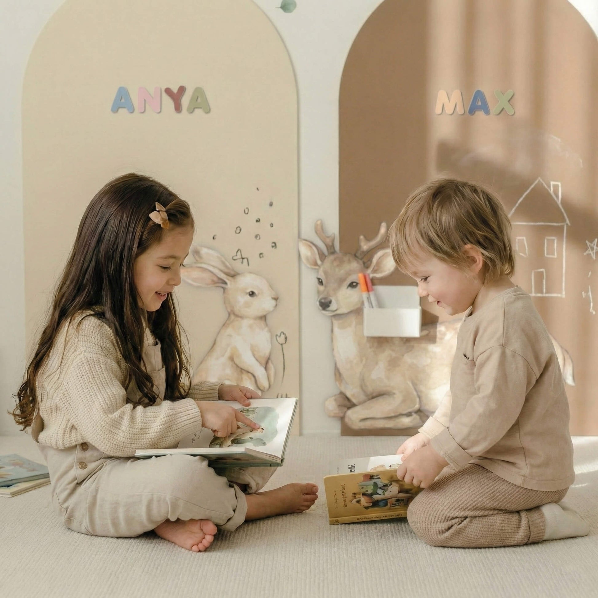 Children playing and reading in front of personalized magnetic story wall with name arches