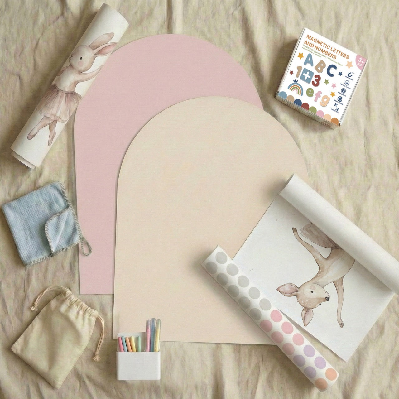 Flatlay of Tiny Koala magnetic story wall bundle with pastel arch boards, ballerina deer wall sticker, magnetic letters, chalk pens, and background dot decals