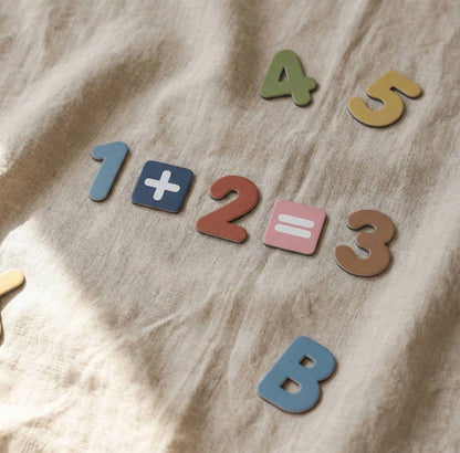 Montessori magnetic numbers and math symbols showing simple addition learning activity