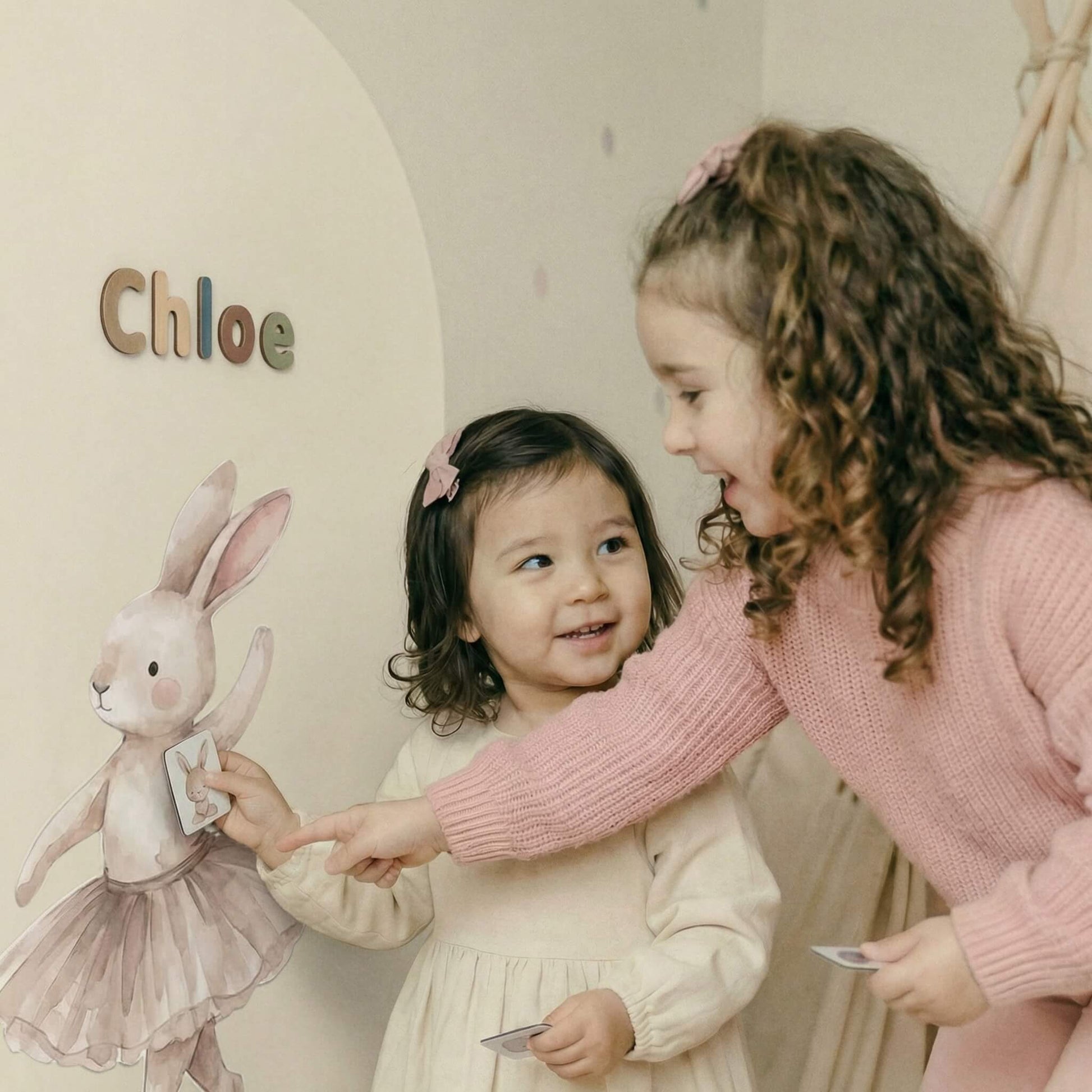 Children playing together on magnetic wall with story character decals and tactile magnets